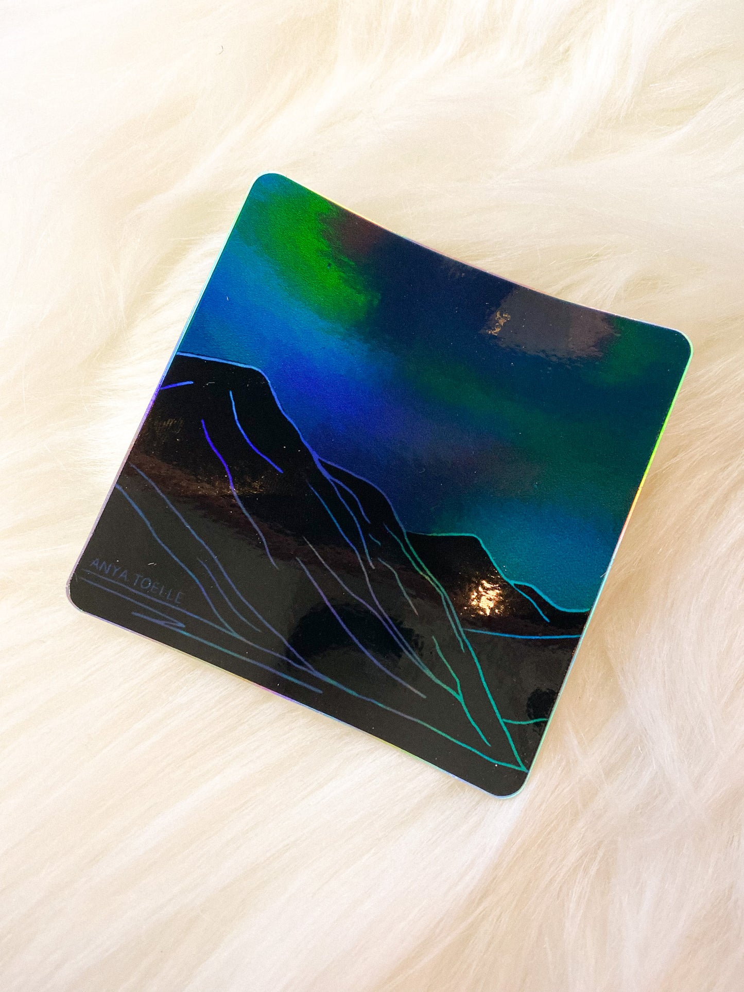 Holographic Mountains Sticker by Anya Toelle