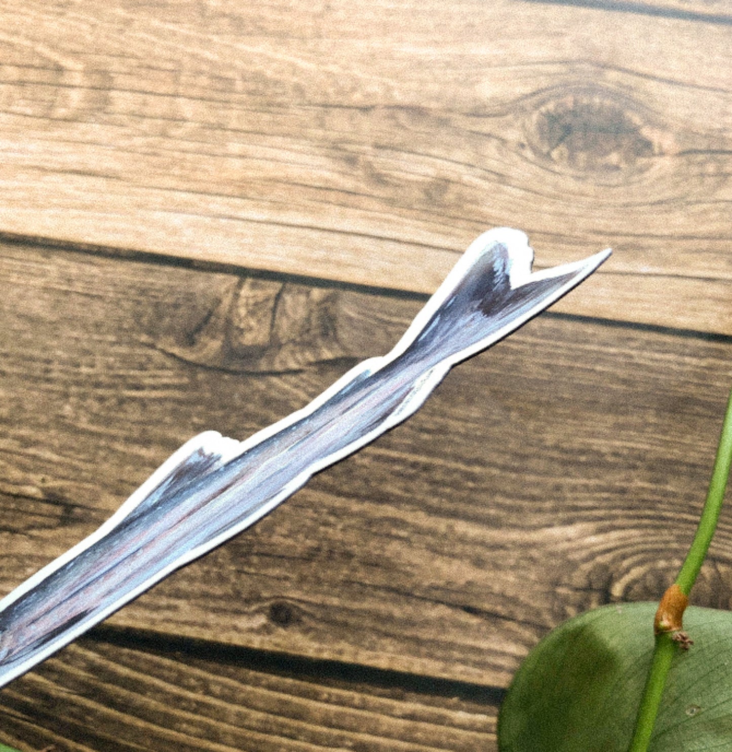 Side of fish magnet on a wooden surface