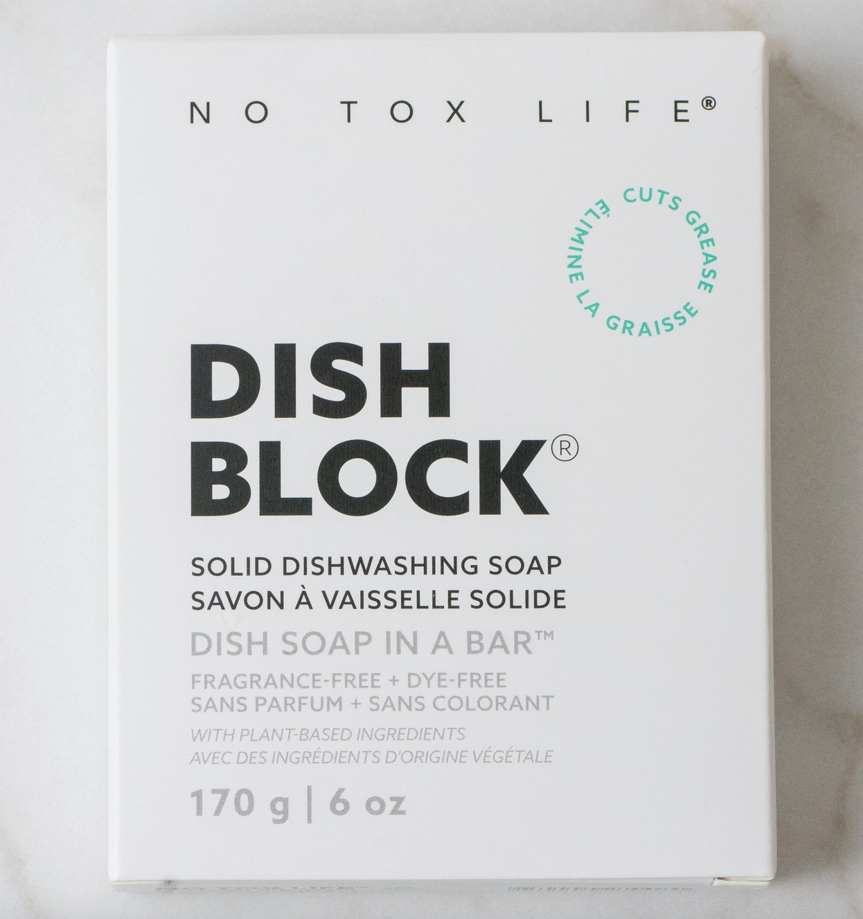 Box of No Tox Life Dish Block solid dishwashing soap on a light background