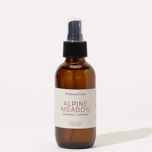 Brown spray bottle labeled 'Alpine Meadow' on a white background