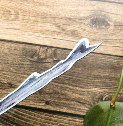 Side of fish magnet on a wooden surface