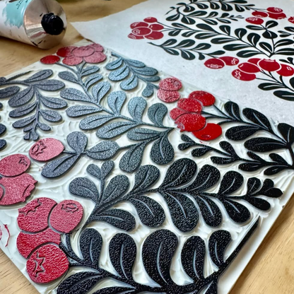 Decorative paper with floral patterns on a wooden surface