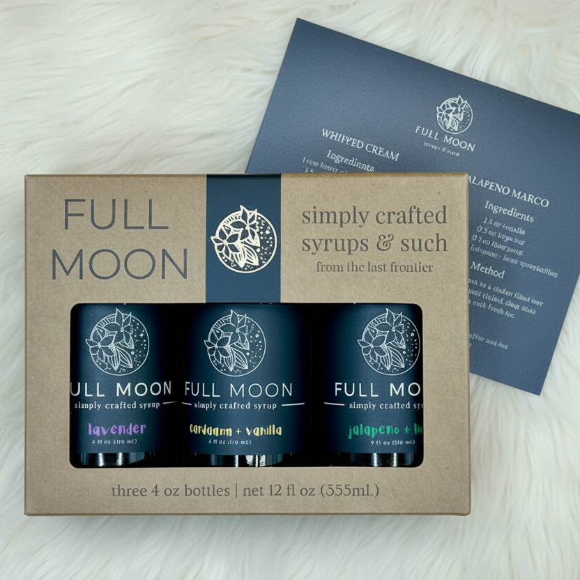 Full Moon syrup set with three bottles in a cardboard box on a beige background